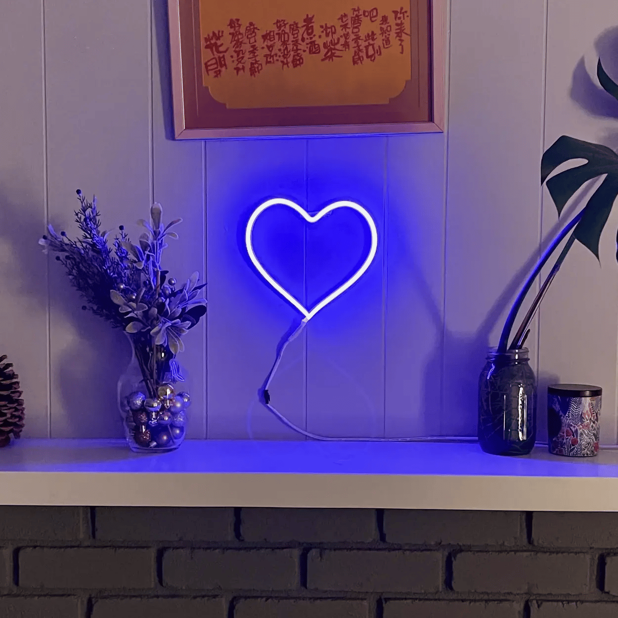 Animated neon heart sign changing between colors