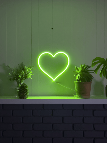 LED neon heart sign that's animated showing three solid colors it can display